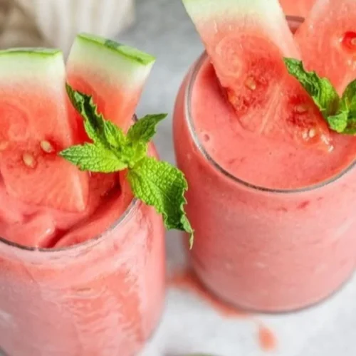 Delicious watermelon smoothie bowl topped with fresh fruits and seeds