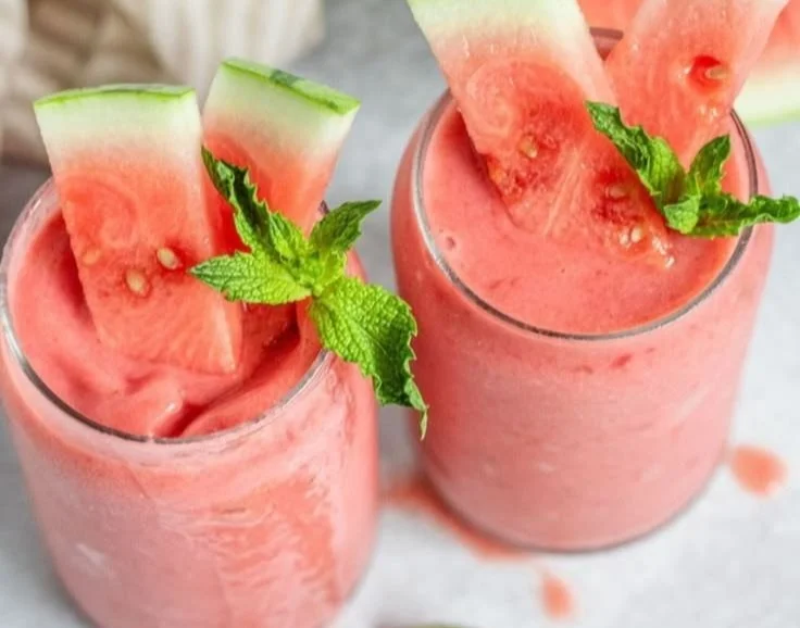 Delicious watermelon smoothie bowl topped with fresh fruits and seeds
