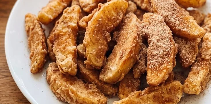 Crispy apple slices with a sweet coating, perfect for a crunchy snack.