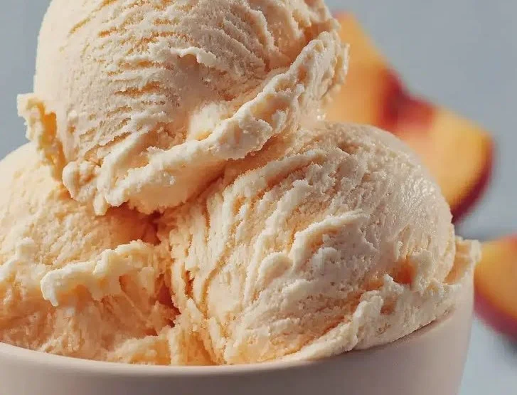 Bowl of homemade peach ice cream made with 3 simple ingredients