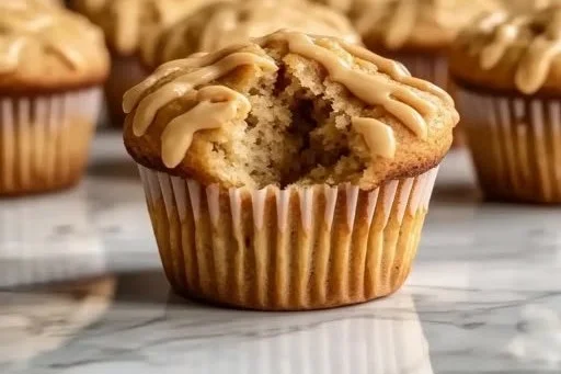 Easy sourdough discard peanut butter muffins on a kitchen counter.