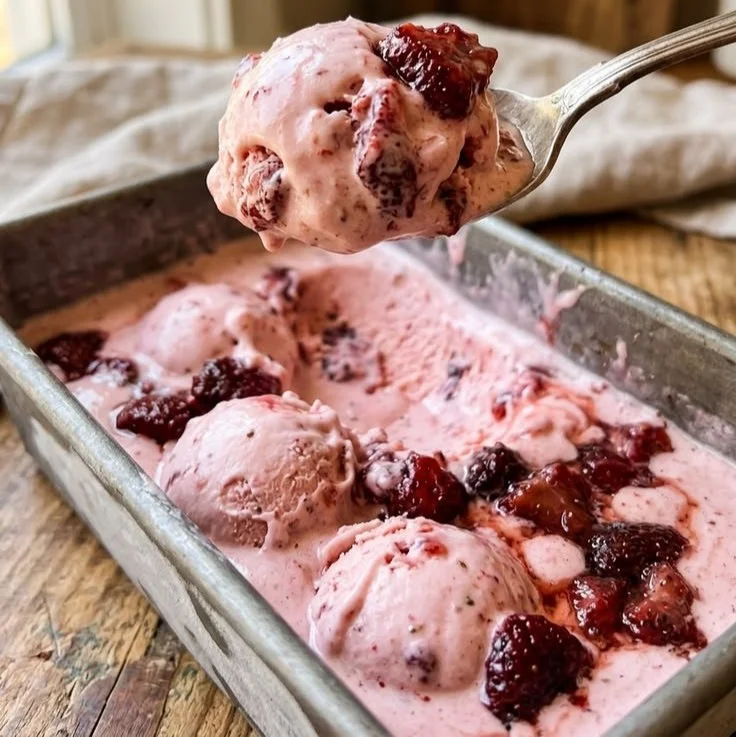 Delicious oven roasted berries served with rich custard in a dessert bowl