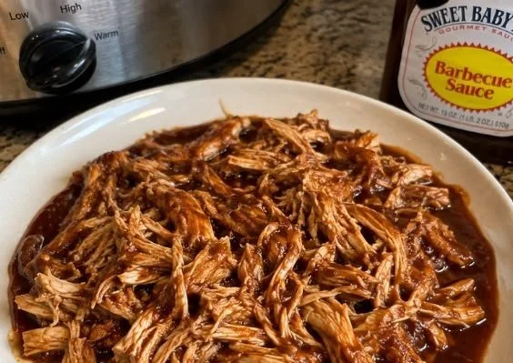 Tender Sweet Baby Ray’s Crockpot Chicken cooked to perfection in a slow cooker.