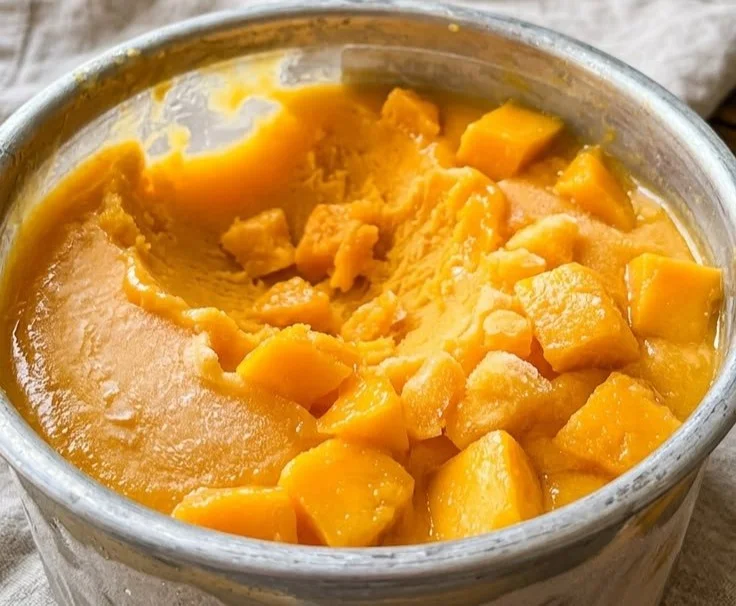 Sweet mango dessert blended with a frozen base for a refreshing treat.