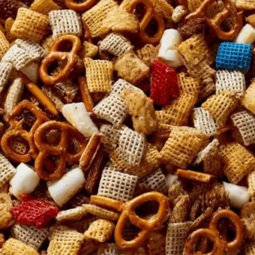 Savory White Trash Snack Mix with turkey bacon and chicken ham twist in a bowl.